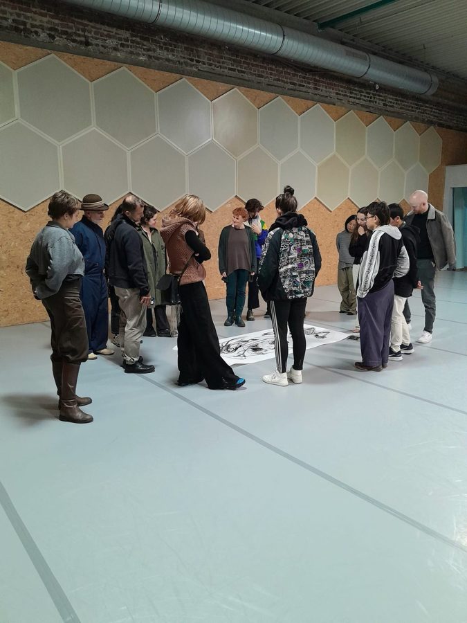 The audience looking at the finished work